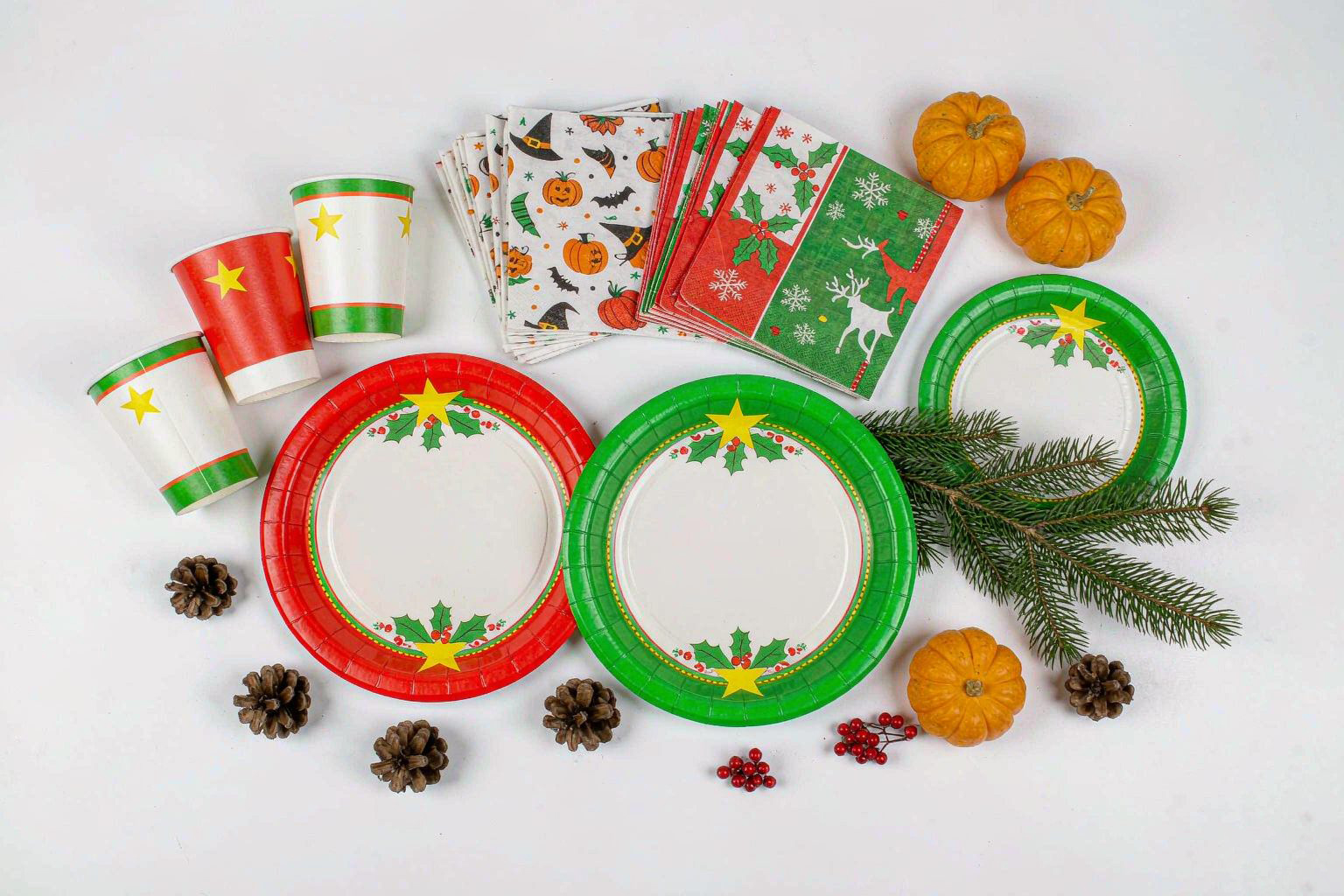 Christmas and Halloween themed napkins, plates and cups